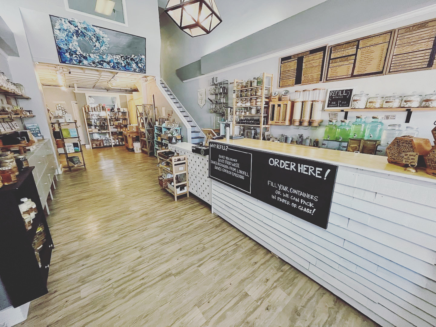 wide shot of inside of store and refill order counter